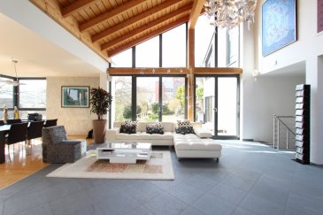 English verion below

** Coup de coeur ** A vendre magnifique villa d'architecte, très lumineuse et idéalement exposée, sur un terrain de 13a50 avec vue dégagée. 

Nous sommes certains que cette propriété garantira à ses futurs propriétaires un très élevé cadre de vie grâce à ses beaux volumes, au nombre généreux de pièces et à ses lignes et perspectives à découvrir jour par jour.

L'étage principale se trouve en bas du hall d'entrée et il se compose d'un spacieux living de +/- 38 m2, entouré par de grandes baies vitrées, donnant sur une première terrasse, d'une salle à manger et d'un espace télé. Plus en retrait se situe la grande cuisine, donnant accès à une deuxième terrasse. Sur le même étage trouvent aussi place une chambre parentale avec salle de bains privative et accès à la terrasse du living, un WC visiteur et l'espace buanderie.

Au rez-de-jardin vous bénéficierez de 4 grandes chambres à coucher, d'une salle de douche et d'un WC séparé. Plus en retrait trouvent place le local technique avec sa chaudière à gaz à condensation, une cave à vin, un local hobby et une grande cave. 

Cette propriété dispose, au rez-de-chaussé, aussi d'un appartement indépendant de 63 m2 (living avec cuisine ouverte, une chambre à coucher, WC séparé et salle de douche) idéale pour recevoir de la famille/des amis ou pour une profession libérale. 

Carport 1-2 voitures et pleureurs stationnement en face à la maison. 

Belles finitions, état impeccable. 

Centre commercial, écoles et piscine de Niederanven à proximité. 

Luxembourg-Kirchberg et Findel joignable en voiture, ou en bus, en 5 minutes 


Wonderfully bright modern villa for sale, ideally located on a 13a50 plot with open view.

We are confident that this property will guarantee its future owners a high living environment thanks to its generous volumes, number of rooms and its lines and perspectives to discover day after day.

The main floor at the bottom of the entrance hall consists of a spacious living room of +/- 38 m², surrounded by large windows overlooking a first terrace, a dining room and a TV room. A large kitchen gives access to a second terrace. On the same floor is also located a parental room with private bathroom and access to the terrace of the living room, a guest WC and a laundry area.

On the ground floor you will enjoy 4 large bedrooms, a shower room and a separate toilet. In the backward place are located the technical room with its condensing gas boiler, a wine cellar, a hobby room and a large storage space.

This property has, on the ground floor, an independent apartment of 63 m² (living room with open kitchen, a bedroom, separate toilet and shower room) ideal for receiving family / friends or a liberal profession.

One carport  for 2 cars and numerous parking spaces available in front of the villa.

Beautiful finishes in perfect condition.

Shopping center, schools and Niederanven swimming pool nearby.

Luxembourg-Kirchberg and Findel reachable by car, or bus, in 5 minutes.






Ref agence :2172800