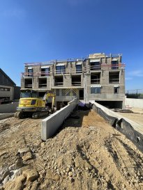 Nous vous présentons en cours de construction un duplex d\'une superficie de 115,95 m² au 1er et 2ième étage de la maison bi-familiale \