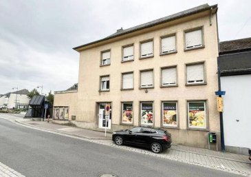 HOUSE FOR YOU ? Maison de rapport à Troivierges (Accès routier + Proximité commerces/écoles. Idéal investisseurs / rendement locatif ? à saisir. Cette de maison de rapport, bénéficiant d'une bonne accessibilité routière et de la proximité des écoles et commerces, un atout majeur pour attirer et fidéliser des locataires.  
Le bien se compose comme suit :  
Rez-de-chaussée :  
- Local commercial  
- 2 bureaux  
- Surface d'environ 109 m²  
- Sous-sol :  
  - 2 bureaux (ou salles d'archives)  
  - 2 WC séparés  
En location : 1.200 €/mois (hors charges)  
1er et 2ème étages  
- 2 appartements d'environ 80 m² chacun se compose :  
Cuisine équipée, living, 2 chambres et salle de douche.  
  - 1 appartement : 1.100 €/mois (hors charges)  
  - 1 appartement : 1.300 €/mois (hors charges)  
Grenier :  
- Possibilité d'aménager un studio (si autorisation communale), offrant un potentiel de valorisation supplémentaire.  
Points techniques  
- Dalles en béton  
- Double vitrage PVC  
- Chaudière gaz  
Pourquoi c'est intéressant pour un investissement ?  
- Revenus locatifs déjà en place (commerce + appartements)  
- Diversification locative (bureaux/appartements/local)  
- Potentiel d'extension/aménagement au grenier  
- Secteur pratique : accès routier plus services à proximité (écoles et commerces), ce qui facilite la recherche de locataires.  
Nous restons à votre disposition pour toute information et visite.