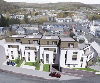 Appartement A2
Appartement d'une surface de +ou- 99m2 situé au premier étage avec une terrasse de +ou- 4.26m2. L'appartement dispose de deux chambres à coucher de 14.57m2 et 16.28m2, une salle de bains, un dressing, un Wc séparé et une cave privative.

Vous pourrez acquérir un emplacement intérieur au prix de 30.000,00€ ou un emplacement extérieur au prix de 15.000,00€.

Le projet comprend 6 nouvelles résidences à toitures plates de style contemporain dans une rue calme et sans issue dans la ville de Tétange.

Les 6 résidences regroupent 16 logements en tout.

4 Résidences ont chacune 2 appartements et 1 penthouse sur deux niveaux par bâtiment, le sous-sol est commun aux 4 bâtiments. Les 4 résidences comprennent 24 emplacements intérieurs et 2 emplacements extérieurs.

Les 2 autres bâtiments ont 2 duplex chacun avec un sous-sol séparé pour les deux bâtiments qui disposent de 4 caves et de 4 emplacements intérieurs doubles.
Les 4 duplex auront des entrées complètement séparés comme dans une maison.

Chaque appartement dispose d'une cave privé.
Les appartements sont spacieux et lumineux disposant de 2 à 4 chambres à coucher avec une voir 2 terrasses par appartements.

Les appartements situés au rez - de - chaussée dispose d'un jardin privé.

Chaque détail a été ici pensé afin de proposer aux futurs occupants un confort de vie optimal.
Des équipements et matériaux haut de gamme sélectionnés avec le plus grand soin, des espaces extérieurs comme des terrasses et jardins privés pour les appartements au rez-de-chaussée et des terrasses avec une vue dégagée pour les biens aux étages supérieurs .