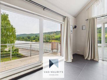 Top-Floor Apartment with Unobstructed Views of the Moselle
± 184 m² living space | 4 bedrooms | Expansion potential

This bright and spacious apartment is located on the top floor of a two-unit residence built in 2005 and stands out for its generous proportions and breathtaking panoramic views over the Moselle River and surrounding vineyards.

The main living area, set under the roof, spans around 60 m² and features a large, full-height frameless window that floods the space with natural light.
A stylish bookcase, a fully equipped kitchen adjoining the dining area, and direct access to a covered balcony create a warm and seamless living atmosphere ? with the river as a stunning backdrop.
A separate hallway leads to three large bedrooms (14 m², 15 m², 19 m²), a bathroom, and a separate WC.
One of these rooms is currently used as a home office.
The master suite (16 m²), set apart from the others, includes its own bathroom with bathtub, shower, and double sink, a spacious dressing area, and direct access to a private rear terrace.

The apartment features underfloor heating powered by oil.
Windows are double-glazed with manual roller shutters.

Additional amenities include a private laundry room, a large basement of approximately 35 m², a garage equipped with an electric car charging station, and two further outdoor parking spaces.
A private garden plot at the rear of the building completes the exterior.

Expansion potential
The undeveloped attic offers an additional approx. 98 m² of usable space.
A development project has been presented to the local authorities, who confirmed that conversion of the attic is possible, provided certain adjustments to the project are made. 
The current proposal has not yet received formal approval.

The residence is set in a quiet, slightly elevated position above the Moselle, offering unobstructed views and no flood risk. A peaceful, green environment within easy reach of shops and restaurants ? ideal for those seeking to combine nature, the local wine lifestyle, and everyday practicality.

Nearby schools
Close by is the Dreiborn school campus, which includes a nursery (