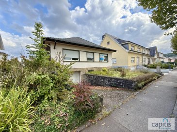 CAPITIS vous présente cette maison individuelle pleine de potentiel, idéalement située à Dudelange, sur une spacieuse parcelle de 21,20 ares, dont 16,20 ares à l'arrière de la maison. Située en zone d'habitation 1 et en zone superposée soumise à un PAP 