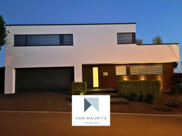 Modern Family Villa with Garden, Pond, Gym & Sauna - Border of Luxembourg, Wincheringen

Located in the picturesque town of Wincheringen, just moments from the Mosel River and the Luxembourg border, this beautifully crafted family home blends generous space, modern comfort, and architectural elegance. Designed by an architect, the interiors feature expansive windows that flood the home with natural light and highlight its clean, contemporary lines.

Built in 2016 on a spacious 823 m² plot with ideal sun exposure, the property offers 337 m² of refined living space tailored to modern lifestyles. Bright, open interiors are paired with high-end finishes and thoughtful design details throughout. A state-of-the-art geothermal heating and cooling system ensures year-round comfort, while an advanced home automation setup enables remote control of all windows and lighting for maximum convenience and energy efficiency.

Upon entry, a welcoming hall (5 m²) leads to a spacious open-plan living and dining area of 58 m². 
This impressive space offers lovely views over the private garden and its serene, landscaped artificial pond. 
The fully equipped kitchen (13 m²) is modern and practical, ideal for both everyday living and entertaining. 
Located near the entrance, the 14 m² room offers an ideal space for a quiet home office or a welcoming guest room, combining practicality with comfort.
Also on this level are a guest WC with shower (4 m²), a convenient storage room (2 m²), and access to a large terrace with direct entry to the garden ? an ideal space for outdoor meals, relaxation, and family enjoyment.

Upstairs, the home features three generous bedrooms measuring 20 m², 20 m², and 16 m². 
The master suite includes a private dressing room (7 m²), an en-suite showerroom (8 m²), and direct access to the upper-floor balcony - offering a peaceful spot to enjoy the view of the garden. 
The upper floor also includes a spacious 22 m² gallery, a 24 m² gym/SPA, and a dedicated laundry room (7 m²). 
A stylish 9 m² bathroom is complemented by a private sauna, located adjacent to the gym, offering a true wellness experience at home.

Completing the property is a 29 m² garage and a 13 m² technical room on the entry level, providing excellent storage and functionality.

This well-maintained villa offers a rare opportunity to enjoy tranquil living just across the border from Luxembourg, with shops, schools, daycare, and transport links all close by. Whether you're commuting, working from home, or simply enjoying the beauty of the Mosel region, this property has everything you need.

Contact:
Juha Ahonen
+352 661 249 476
juha@vanmaurits.lu

Villa Familiale Moderne avec Jardin, Étang, Salle de Sport & Sauna - Frontière Luxembourg, Wincheringen

Située dans la charmante commune de Wincheringen, à deux pas de la Moselle et de la frontière luxembourgeoise, cette villa familiale d'architecte allie avec élégance volumes généreux, confort moderne et lignes épurées. De grandes baies vitrées baignent les espaces de lumière naturelle, mettant en valeur le design contemporain et l'ambiance chaleureuse des lieux.

Construite en 2016 sur un terrain de 823 m² idéalement orienté, la maison propose une surface habitable de 337 m², parfaitement adaptée au mode de vie moderne. Les intérieurs lumineux sont rehaussés de finitions haut de gamme et de nombreux détails de conception soignés. Un système géothermique dernière génération assure le chauffage et la climatisation, tandis que la domotique permet de contrôler à distance l'éclairage et les fenêtres pour un confort optimal et une grande efficacité énergétique.

Dès l'entrée, un hall accueillant de 5 m² ouvre sur une vaste pièce de vie de 58 m² regroupant salon et salle à manger. Cet espace convivial offre une vue dégagée sur le jardin privatif et son étang paysager.
La cuisine entièrement équipée de 13 m² est à la fois moderne et fonctionnelle, idéale pour le quotidien comme pour recevoir.
Une pièce de 14 m², située près de l'entrée, peut faire office de bureau calme ou de chambre d'amis confortable.
Un WC avec douche (4 m²), un espace de rangement (2 m²) et une grande terrasse avec accès direct au jardin complètent ce niveau ? parfait pour les repas en extérieur, les moments de détente ou les jeux en famille.

À l'étage, trois belles chambres de 20 m², 20 m² et 16 m² offrent un cadre paisible pour toute la famille.
La suite parentale dispose d'un dressing privatif (7 m²), d'une salle de douche attenante (8 m²) et d'un accès direct au balcon du premier étage ? un coin idéal pour profiter de la vue sur le jardin.
Le niveau comprend également une galerie spacieuse de 22 m², une salle de sport/SPA de 24 m² et une buanderie indépendante de 7 m².
Une salle de bain élégante de 9 m² est accompagnée d'un sauna privé, situé juste à côté de la salle de sport, pour une véritable expérience bien-être à domicile.
Un garage de 29 m² et un local technique de 13 m² au rez-de-chaussée offrent un espace de rangement optimal et un excellent niveau de fonctionnalité.

Parfaitement entretenue, cette villa unique représente une opportunité rare de vivre au calme à deux pas du Luxembourg, avec commerces, écoles, crèches et transports à proximité. Que vous soyez frontalier, télétravailleur ou amoureux de la région de la Moselle, cette maison a tout pour plaire.

Contact :
Juha Ahonen
+352 661 249 476
juha@vanmaurits.lu


Moderne Familienvilla mit Garten, Teich, Fitnessraum & Sauna - Grenznähe Luxemburg, Wincheringen

Diese architektonisch gestaltete Familienvilla befindet sich im idyllischen Wincheringen, nur wenige Schritte von der Mosel und der luxemburgischen Grenze entfernt. Sie verbindet großzügige Wohnflächen, modernen Komfort und stilvolle Eleganz auf beeindruckende Weise. Große Fensterflächen durchfluten das Haus mit Tageslicht und unterstreichen die klare, zeitgemäße Linienführung.

Das 2016 erbaute Haus steht auf einem großzügigen Grundstück von 823 m² mit idealer Sonnenausrichtung und bietet 290 m² hochwertig ausgestattete Wohnfläche - perfekt zugeschnitten auf ein modernes Familienleben. Helle, offene Räume, edle Materialien und durchdachte Details schaffen ein wohnliches Ambiente. Eine moderne Erdwärmeheizung sorgt das ganze Jahr über für angenehmes Klima, ergänzt durch ein Smart-Home-System zur komfortablen Steuerung von Licht und Fenstern - auch aus der Ferne.

Im Eingangsbereich empfängt Sie ein freundlicher Flur (5 m²), der in einen offenen Wohn- und Essbereich von 58 m² führt.
Große Fenster eröffnen den Blick auf den privaten Garten mit seinem harmonisch angelegten Zierteich.
Die moderne, voll ausgestattete Küche (13 m²) ist funktional und stilvoll ? ideal für den Alltag und für Gäste.
Ein zusätzliches Zimmer (14 m²) nahe dem Eingang eignet sich hervorragend als ruhiges Homeoffice oder als Gästezimmer.
Ein Gäste-WC mit Dusche (4 m²), ein praktischer Abstellraum (2 m²) sowie eine großzügige Terrasse mit direktem Zugang zum Garten runden das Erdgeschoss ab - perfekt für Mahlzeiten im Freien, Erholung oder Spiel mit der Familie.

Im Obergeschoss befinden sich drei großzügige Schlafzimmer mit 20 m², 20 m² und 16 m².
Die Elternsuite verfügt über ein eigenes Ankleidezimmer (7 m²), ein modernes Duschbad (8 m²) sowie direkten Zugang zum Balkon mit Blick in den Garten - ein idealer Rückzugsort.
Eine offene Galerie (22 m²), ein Fitness- und SPA-Bereich (24 m²) sowie ein separater Hauswirtschaftsraum (7 m²) ergänzen das Obergeschoss.
Ein stilvolles Badezimmer (9 m²) und eine angrenzende Sauna bieten Wellness pur - ganz privat in den eigenen vier Wänden.

Komplettiert wird das Haus durch eine geräumige Garage (29 m²) und einen Technikraum (13 m²) im Eingangsbereich - funktional und durchdacht.
Diese gepflegte Villa bietet eine seltene Gelegenheit, ruhiges Wohnen in unmittelbarer Nähe zu Luxemburg zu genießen - mit Einkaufsmöglichkeiten, Schulen, Kindergärten und Verkehrsanbindung in nächster Umgebung. Ob für Berufspendler, Homeoffice-Nutzer oder Naturliebhaber der Moselregion - dieses Haus erfüllt alle Ansprüche.

Kontakt:
Juha Ahonen
+352 661 249 476
juha@vanmaurits.lu