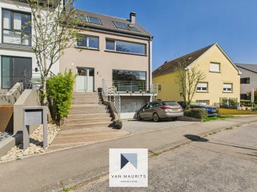 Situé à Gostingen dans la commune de Flaxweiler, cette maison construction datant de 2007, sur un terrain de 8.08 ares dont 4.11 constructibles, bénéficie d'une surface totale de ± 252 m² dont ± 205 m² habitables et se compose comme suit :

Au rez-de-chaussée, un hall d'entrée de ± 5 m² avec un vestiaire de ± 1 m² dessert un séjour salon/salle à manger de ± 37 m² avec une cuisine ouverte équipée/aménagée de ± 13 m² et accès à un balcon de ± 23 m² équipée d'une pergola et un escalier vers le jardin.

Le hall d'entrée dessert aussi un WC séparé de ± 2 m² et la cage d'escalier.

Au 1ier étage la cage d'escalier donne sur un palier de ± 4 m² qui dessert trois chambres de ± 8, 16 et 18 m², ainsi qu'une salle de bain de ± 16 m² (lavabo, miroir, baignoire, douche, rangements et WC).

Au 2ième étage un grenier sous-combles aménagée de ± 41 m², avec possibilité de faire une salle de bain (connexion eau et électricité existant)

Au rez-de-jardin, la cage d'escalier donne dans le garage de ± 36 m² (2 voitures) qui dessert une chaufferie de ± 9 m², ainsi que 2 chambres, une de ± 19 m² avec un espace buanderie (± 2 m²) et une salle de douche séparée de ± 5 m² (lavabo, miroir, douche et WC) et une deuxième chambre de ± 20 m². Les 2 chambres sont communicantes et ont accès à une terrasse de ± 21 m² et au jardin.

Un jardin de ± 275 m² et trois emplacements de parking devant la maison viennent compléter cette offre.

Détails complémentaires :

- Maison datant de 2007
- Chauffage au mazout, chauffage par radiateur
- Fenêtres avec châssis aluminium, double vitrage, volets manuels, vélux (PVC) avec stores et moustiquaires (2 vélux)
- Fenêtres avec moustiquaires
- Cheminée et poêle à bois
- Câblage haut-parleurs séjour
- Borne de recharge électrique pour voiture
- Vue côté jardin sur une zone verte non-constructible
- Transport public, arrêt de bus à 40m (bus scolaires, ligne directe vers Luxexpo)

Agent responsable :
Maurits van Rijckevorsel
Tél. : +352621198 891 E-mail : maurits@vanmaurits.lu