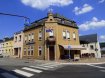 Maison mitoyenne Vente à Rosport - 710 000 € SCHAUS IMMOBILIER vous propose à la vente ce bâtiment hébergeant actuellement un café au sein du village pittoresque de Rosport.
L'entrée se fait par le café où est aménagé un comptoir et un espace avec des tables, avec une cuisine attenante.
Depuis cet espace café un accès se fait à une grande salle de fêtes, disposant d'une scène. Sur une surface d'environ 136 m2 de nombreuses possibilités s'offrent à vous, dont notamment l'aménagement d'une salle de restauration voire d'une pizzeria.
Le bâtiment dispose d'un espace sanitaire avec des WC séparés.
De nombreuses possibilités de stockage s'offrent à vous.
Au premier étage se trouve un premier appartement avec neuf pièces desservies par un palier.
Au second étage se trouve un deuxième appartement avec cinq pièces à aménager.
Ref agence :883023 - VM0278