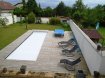 Maison Vente 6 chambres à Ay-sur-Moselle - 519 000 € *** AY-SUR-MOSELLE, MAISON VILLA D' EXCEPTION DE TYPE F7 TOUTES PRESTATIONS ***. Dans un cadre bucolique et stratégique, dans un charmant village bénéficiant de toutes les infrastructures, se trouve cette demeure de belle facture alliant charme et caractère.Elégante et harmonieuse par son architecture, sobre et raffinée par sa décoration, elle séduira les plus exigeants par ses qualités de finition et son agencement étudié ! Au premier niveau : vous y découvrirez sa pièce à vivre traversante habillée d'un magnifique parquet de 58 m² comprenant une cheminée insert ainsi qu' une cuisine américaine entièrement équipée et aménagée.Le tout donnant accès direct sur son terrain entièrement clos, à l' abri des regards comprenant une terrasse, une piscine ainsi qu' une grange de 18 m² environ.Sa chambre d' amis de 13 m² environ bénéficiant d' une douche et d 'un meuble sous vasque.Son espace buanderie, son wc indépendant ainsi que son double garage.A l' étage : Une mezzanine de 15m² surplombant le séjour ! Trois chambres aux beaux volumes, ( 13 et 17 m² )dont sa suite parentale avec dressing et salle de bain, les deux autres comprenant une salle d' eau et meuble sous vasque.Sa pièce de 18 m² comprenant un home cinéma ainsi qu' un bureau. Son wc indépendant.Pour compléter ce bien, une véritable cave d' époque, idéal pour les amateurs de vins. Vous serez charmés par sa luminosité, ses volumes et ses prestations !Pour toutes informations complémentaires et nécessaires à une visite, merci de contacter Sandrine Di Francesco au 06 33 83 40 82 ( Siret 78900935400018).